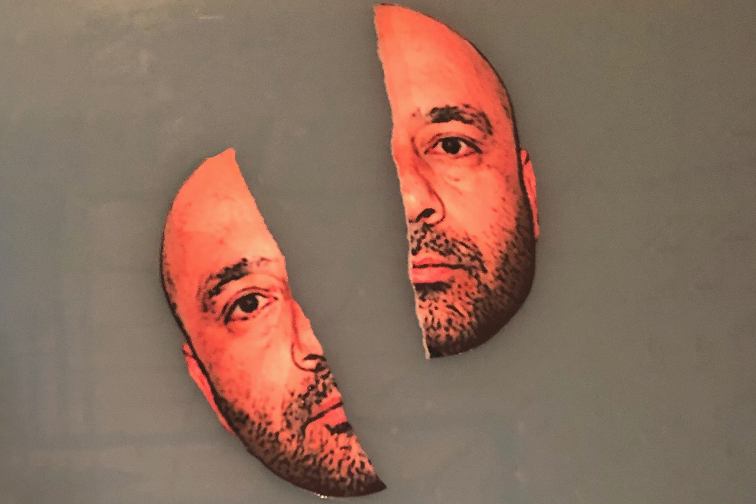 Picture of Ali Dadgar's face that has been cut in half length-wise and placed on a brown background.